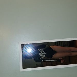 Skin tight black and white skeleton body suit